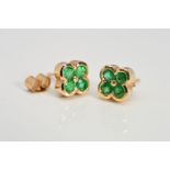 A PAIR OF 9CT GOLD EMERALD STUD EARRINGS designed as a floral cluster of four circular emeralds