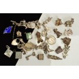 A LATE 20TH CENTURY SILVER CHARM BRACELET, figaro link bracelet, padlock and safety chain,