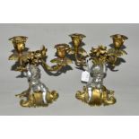 A PAIR OF LATE 19TH CENTURY CANDELABRA, cast with a plated cherub on scrolled base, approximate