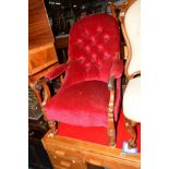 AN EARLY VICTORIAN MAHOGANY BUTTONED BACK VELVET UPHOLSTERED ARMCHAIR