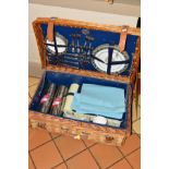 A WICKER BREXTON COLLECTION PICNIC HAMPER, fitted for four settings, including Wedgwood Runnymede