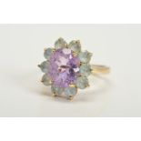 A 9CT GOLD GEM CLUSTER RING, designed as a central oval amethyst within a circular aquamarine