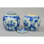 A PAIR OF CHINESE PORCELAIN GINGER JARS, blue and white with prunus blossom and panels with