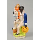 A STAFFORDSHIRE POTTERY FIGURE GROUP, 'Uncle Tom', height 25.5cm