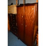 A STAG MINSTRAL FOUR PIECE BEDROOM SUITE comprising a double door wardrobe, low chest of six drawers