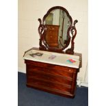 A MID VICTORIAN MAHOGANY DRESSING TABLE/WASHSTAND, shaped ova; mirror on foliate scrolled arms above