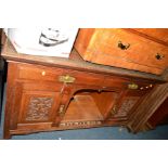 AN EDWARDIAN CARVED OAK SIDEBOARD, an oak church pew and four oak chairs including two carvers (6)