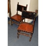 A PAIR OF 19TH CENTURY OAK HALL CHAIRS, the top flanked by a pair of lions heads, with studded