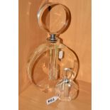 TWO CIRCULAR SHAPED GLASS PERFUME BOTTLES, height of largest 28cm and smallest height 10cm (2)