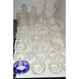 A GROUP OF CUT GLASS etc to include four decanters, vases, bowls and drinking glasses etc