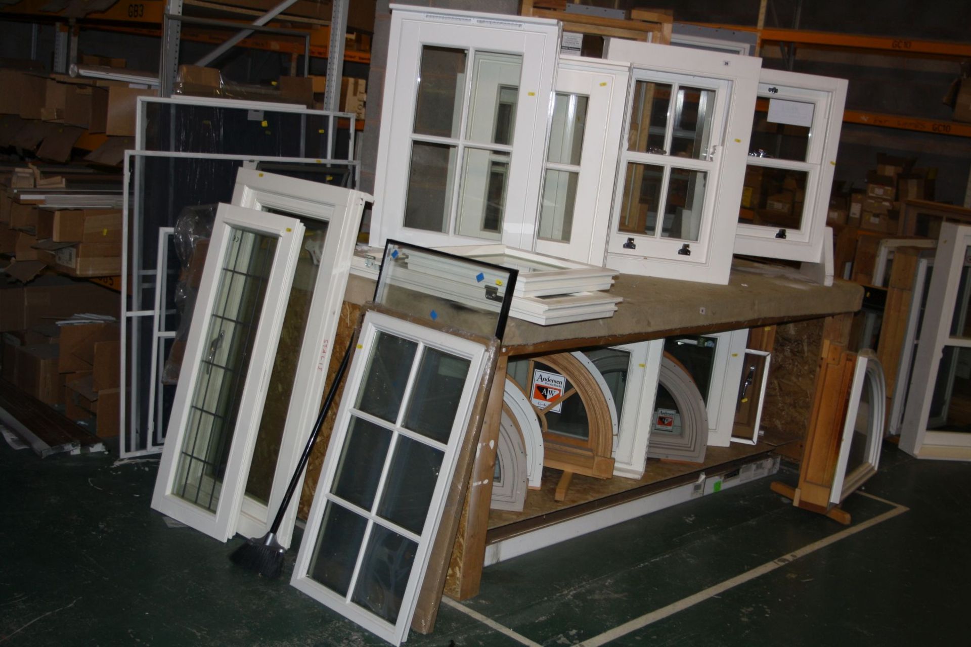 TWELVE DOUBLE GLAZED WINDOWS, FOUR HALF ROUND DOOR TOPPERS AND A QUADRANT all mounted for display