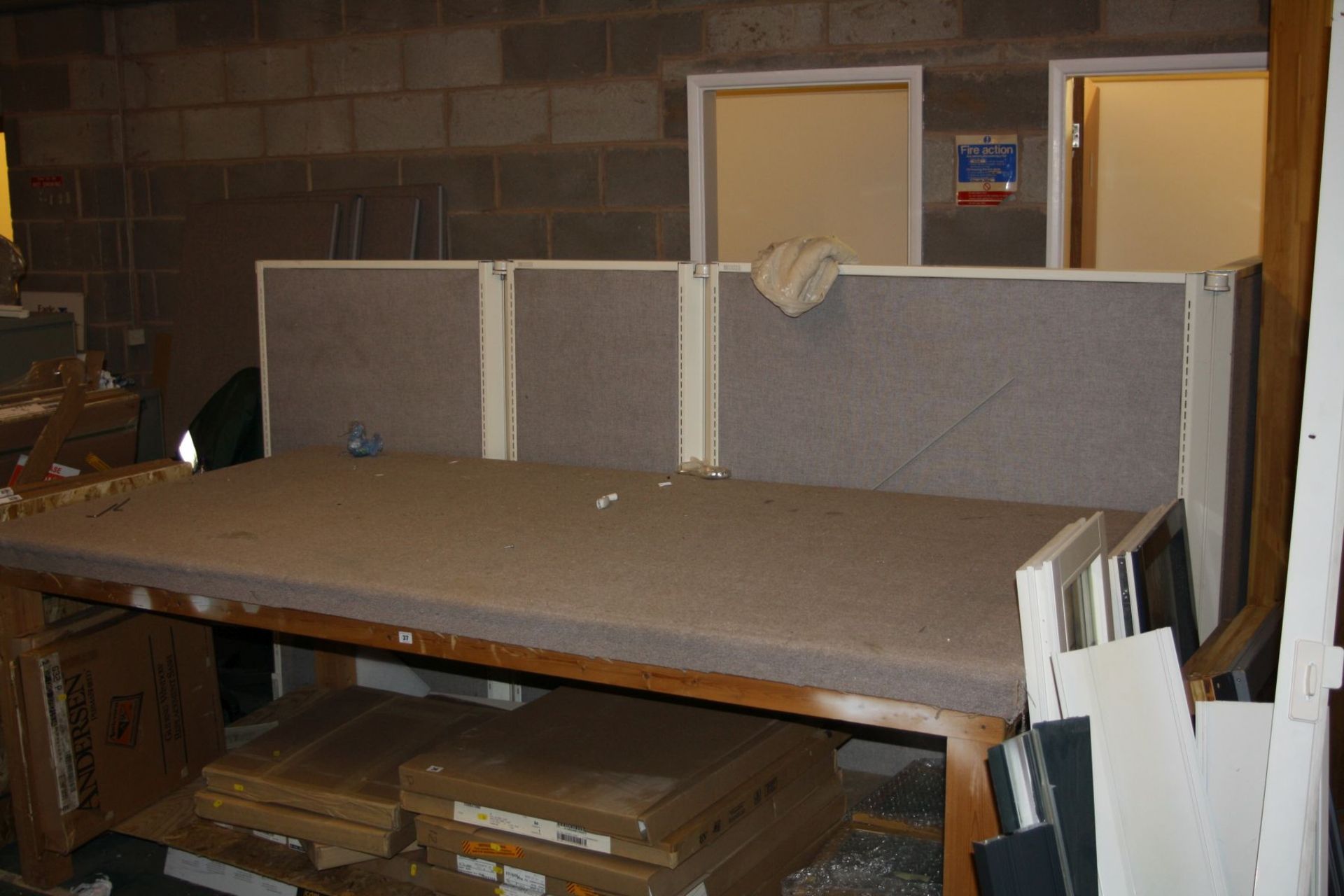 A HEAVY DUTY PINE WORK TABLE with a carpeted top and an undershelf measuring 249cm long x 125cm deep