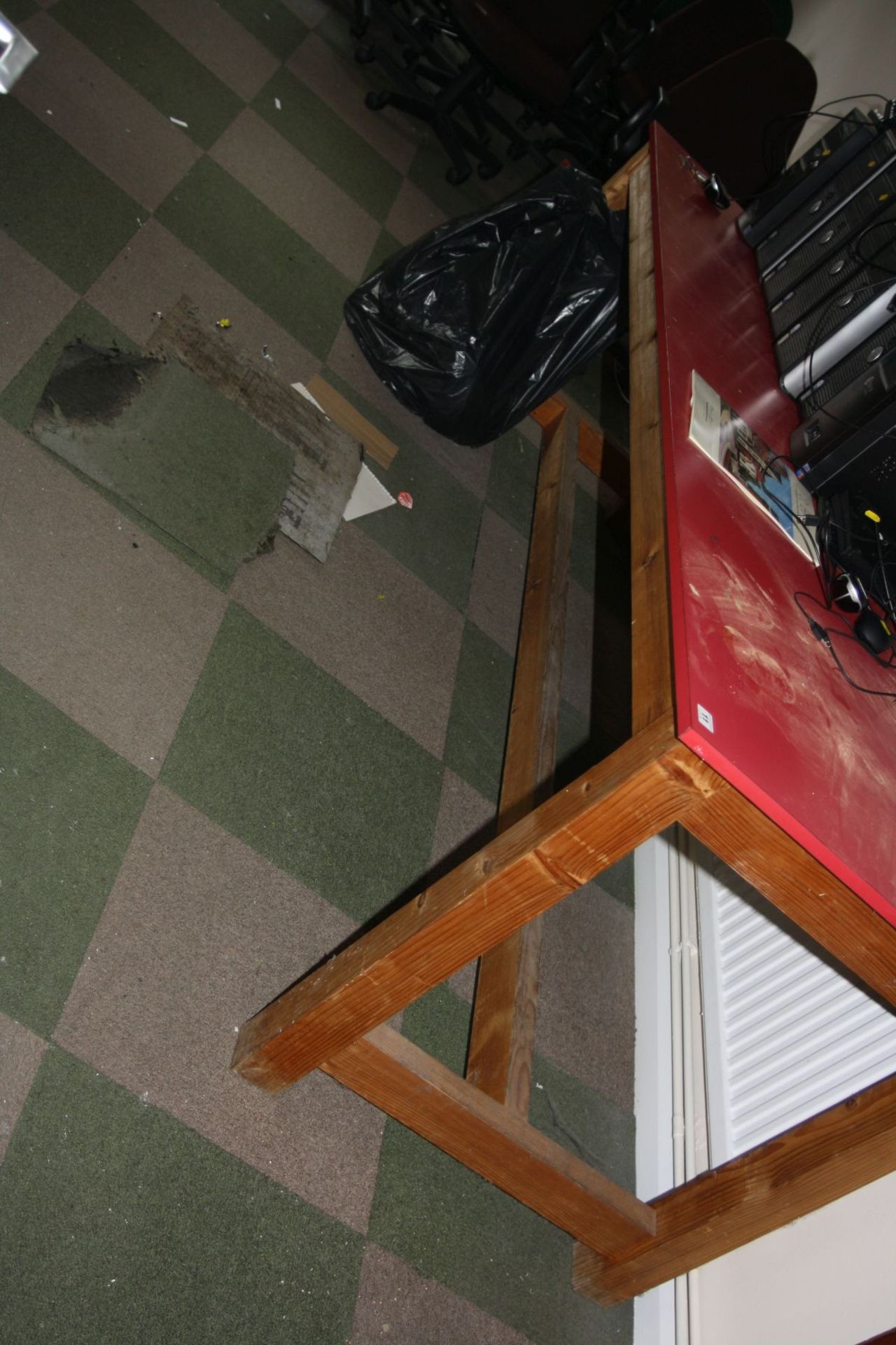 A LARGE PINE FRAMED WORK TABLE, with a red Melamine top