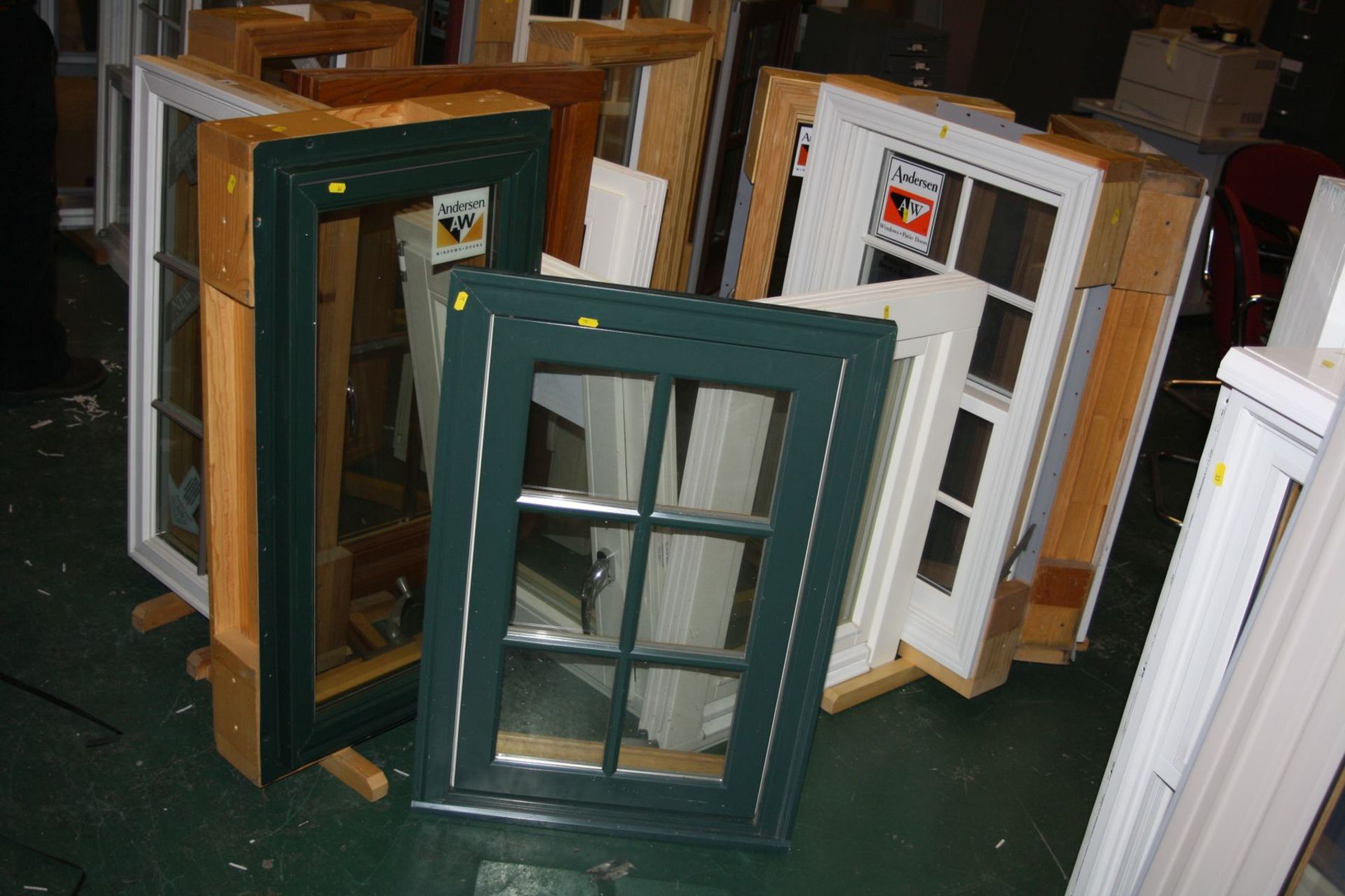 TWELVE DOUBLE GLAZED WINDOWS all mounted for display purposes. These include a green and pine roof