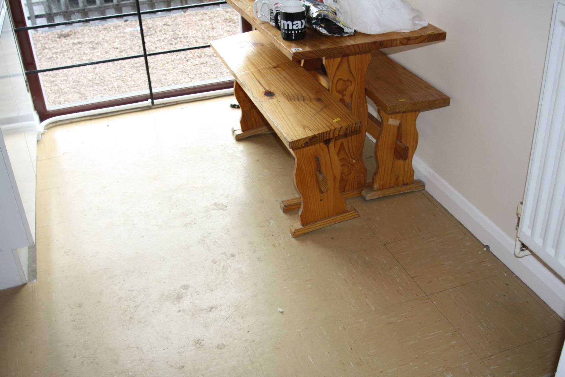 A PINE KITCHEN TABLE, two benches and various crockery