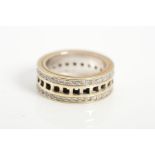 AN 18CT WHITE GOLD DIAMOND GUCCI SPINNER RING, designed as a central line of pierced squares, with