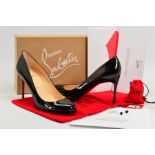 A PAIR OF CHRISTIAN LOUBOUTIN BLACK FIFI PATENT HEELED SHOES, the classic heeled pump with rounded