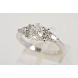 A MODERN PLATINUM DIAMOND DRESS RING, centring on an oval modern brilliant cut diamond,