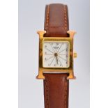 A LADIES GOLD PLATED HERMES WRISTWATCH, 'H' shaped case, white radiant gold line style dial with