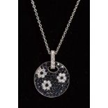 A MODERN ROBERTO COIN 18CT WHITE GOLD DARK BLUE SAPPHIRE AND DIAMOND PENDANT, a circular floral