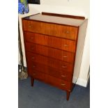 A TALL 1960'S/70'S TEAK CHEST OF SIX DRAWERS with brassed handles on four tapering legs, width 76.