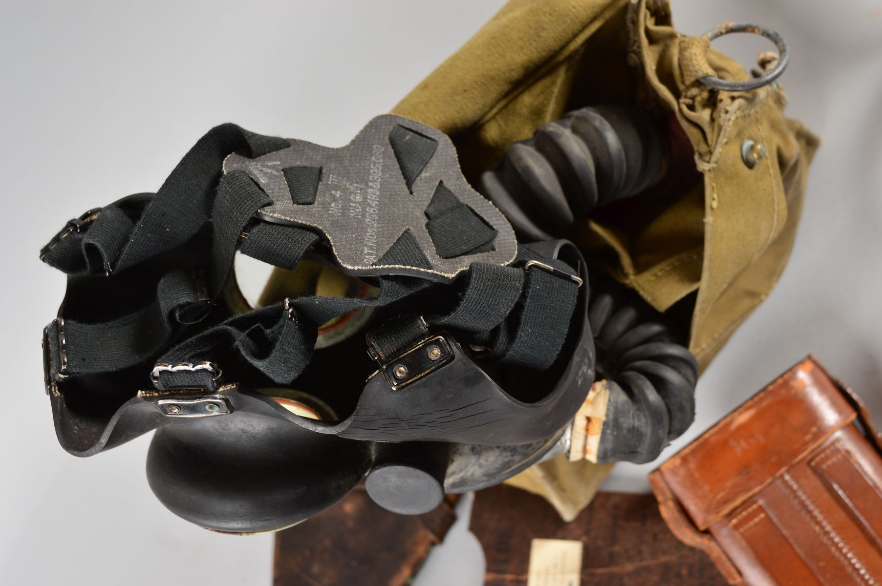A BOX CONTAINING A WWII ERA BRITISH GAS MASK AND EYE SHIELDS, in green canvas bag, inside the - Image 3 of 3