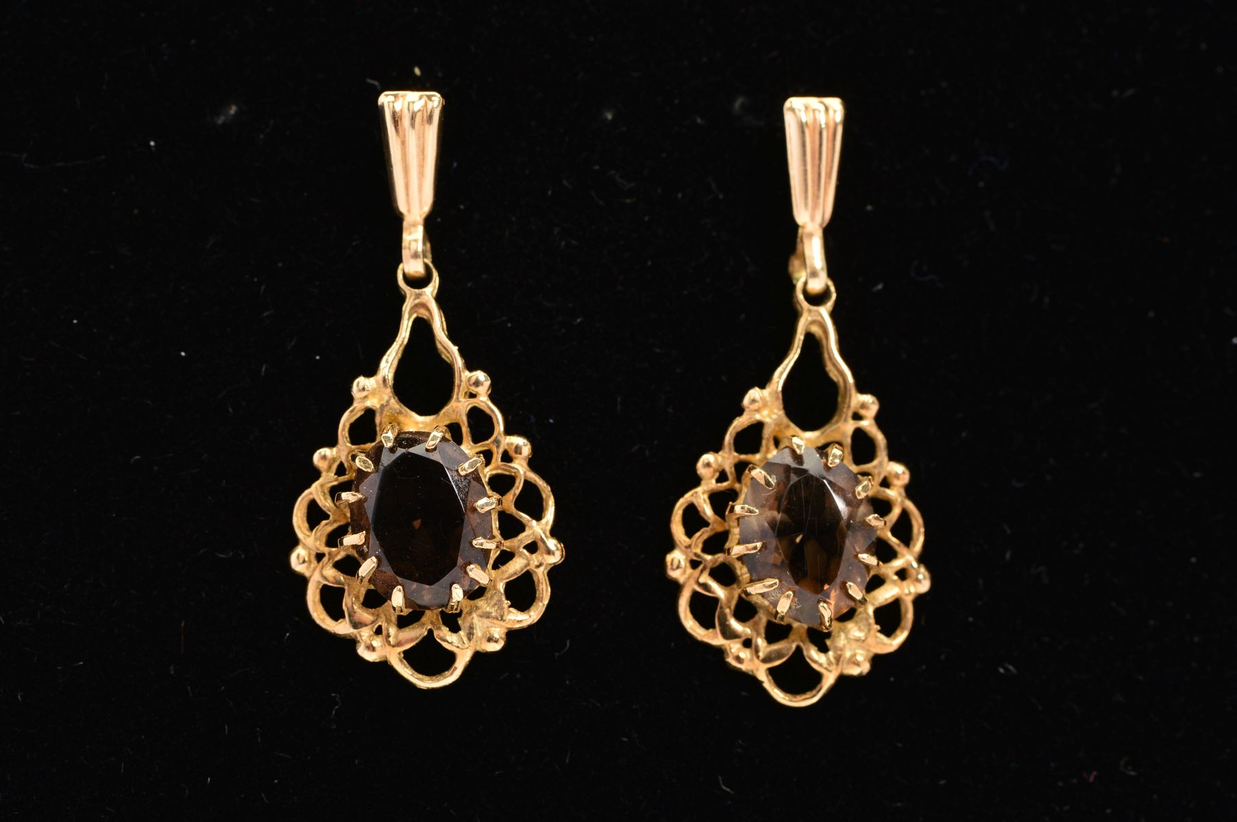 A PAIR OF 9CT GOLD SMOKY QUARTZ DROP EARRINGS, each designed as an oval smoky quartz within a claw