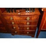 A GEORGIAN MAHOGANY CHEST OF TWO DEEP DRAWERS on bracket feet, width 66cm x depth 51cm x height