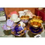A GROUP OF COALPORT CABINET MINIATURE CUPS AND SAUCERS, to include two cups and saucers, one