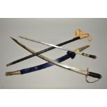 TWO SWORDS, one in wooden and blue velvet scabbard, poor condition, blade engraved made in India,