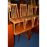 A 1980'S TEAK DROP LEAF DINING TABLE and four chairs (5)