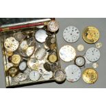 A TIN OF WATCH MOVEMENTS AND WATCH PARTS, to include watch heads, pocket watch movements, wrist