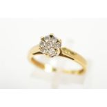 A DIAMOND CLUSTER RING, designed as a circular cluster of seven brilliant cut diamonds, total