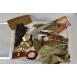 A LARGE GLASS TOP DEALER STYLE DISPLAY CASE CONTAINING THE FOLLOWING MILITARY ITEMS, WWII era or
