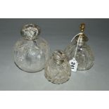 TWO CUT GLASS SPHERICAL SCENT BOTTLES, with damaged silver mounts, together with a silver mounted