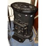 A BLACK PAINTED GODIN GAS STOVE, height 77cm