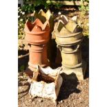 FOUR VARIOUS CHIMNEY POTS, average height 75cm, comprising three circular and one squared,