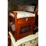 AN EDWARDIAN MAHOGANY PIANO STOOL with a floral carved panel front