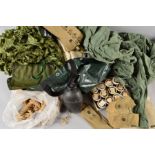 A LARGE PLASTIC BAG CONTAINING VARIOUS MILITARIA, to include two large Woodland camo nets, various