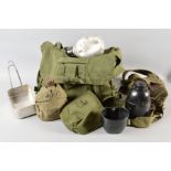 A LARGE DRAB OLIVE KIT BAG, containing a variety of Mess tins, 1945 issue, water bottles,