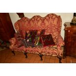 AN EARLY 20TH CENTURY GEORGIAN STYLE THREE SEATER SOFA, triple arched back, red and gold upholstery,