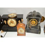 A BLACK SLATE AND MARBLE MANTLE CLOCK WITH A BLACK AND GILT FACE AND ROMAN NUMERAL MARKERS, together