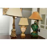 A 20TH CENTURY GILT TABLE LAMP with putti decoration, together with two Greek style table lamps (all