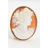 A MID 20TH CENTURY CAMEO BROOCH, oval measuring approximately 42mm x 33mm, a shell cameo depicting a