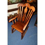 AN ELM AND MAHOGANY WINDSOR ROCKING CHAIR