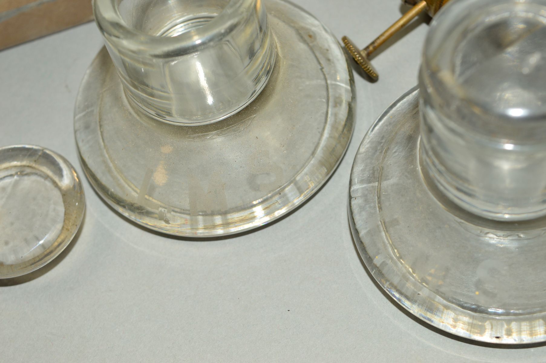 A PAIR OF L.M.S. GLASS INKWELLS, both complete with lids, have few minor marks but no chips or - Image 2 of 5