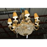 A GILT METAL CIRCULAR CHANDELIER, with eight branches and bead swags, height 57cm and four