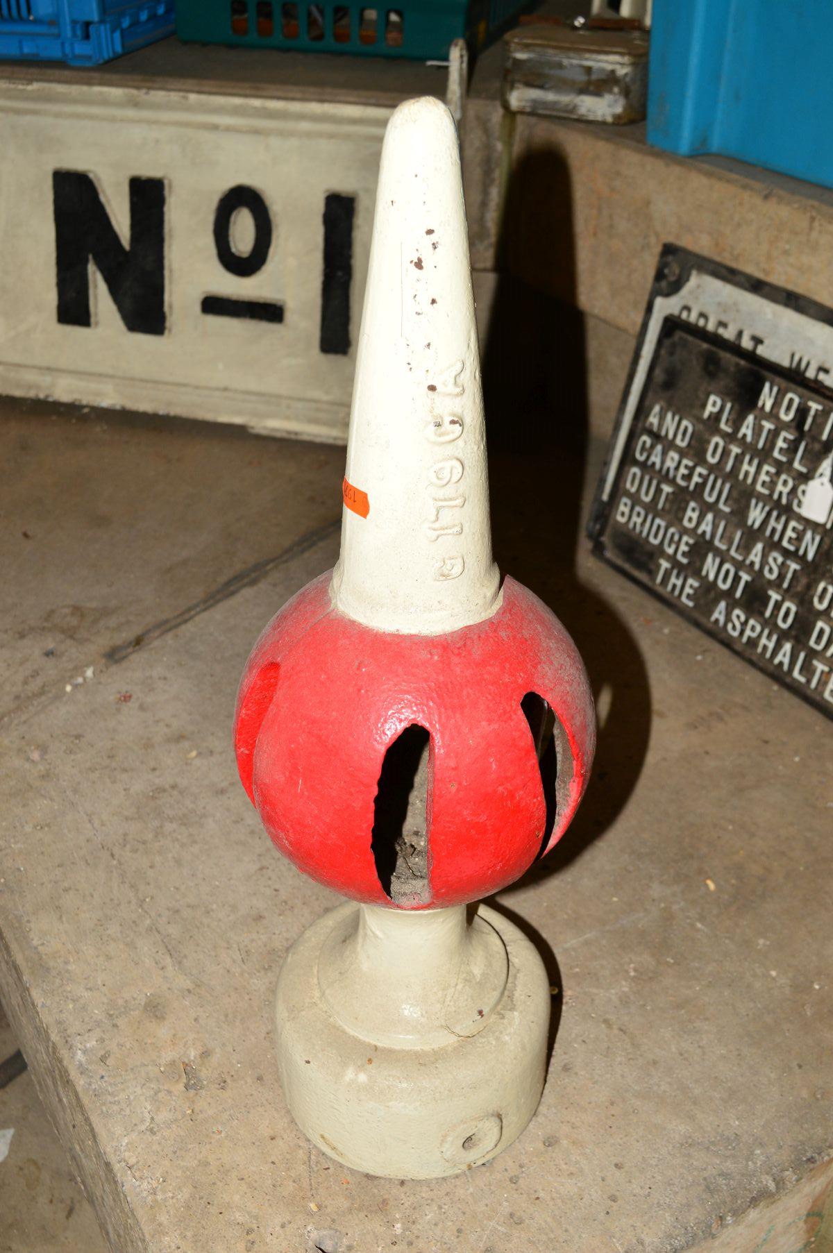 A CAST IRON BALL & SPIKE SIGNAL POST FINIAL, restored, white with red ball, stamped G179CA and E,