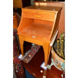 A DANISH TEAK TELEPHONE TABLE with a pull out stool and a single drawer and a chrome framed two tier