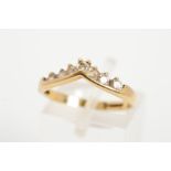 A 9CT GOLD CUBIC ZIRCONIA WISHBONE SHAPE RING, the wishbone line set with a row of circular